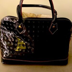 Arcadia black patten leather bag.